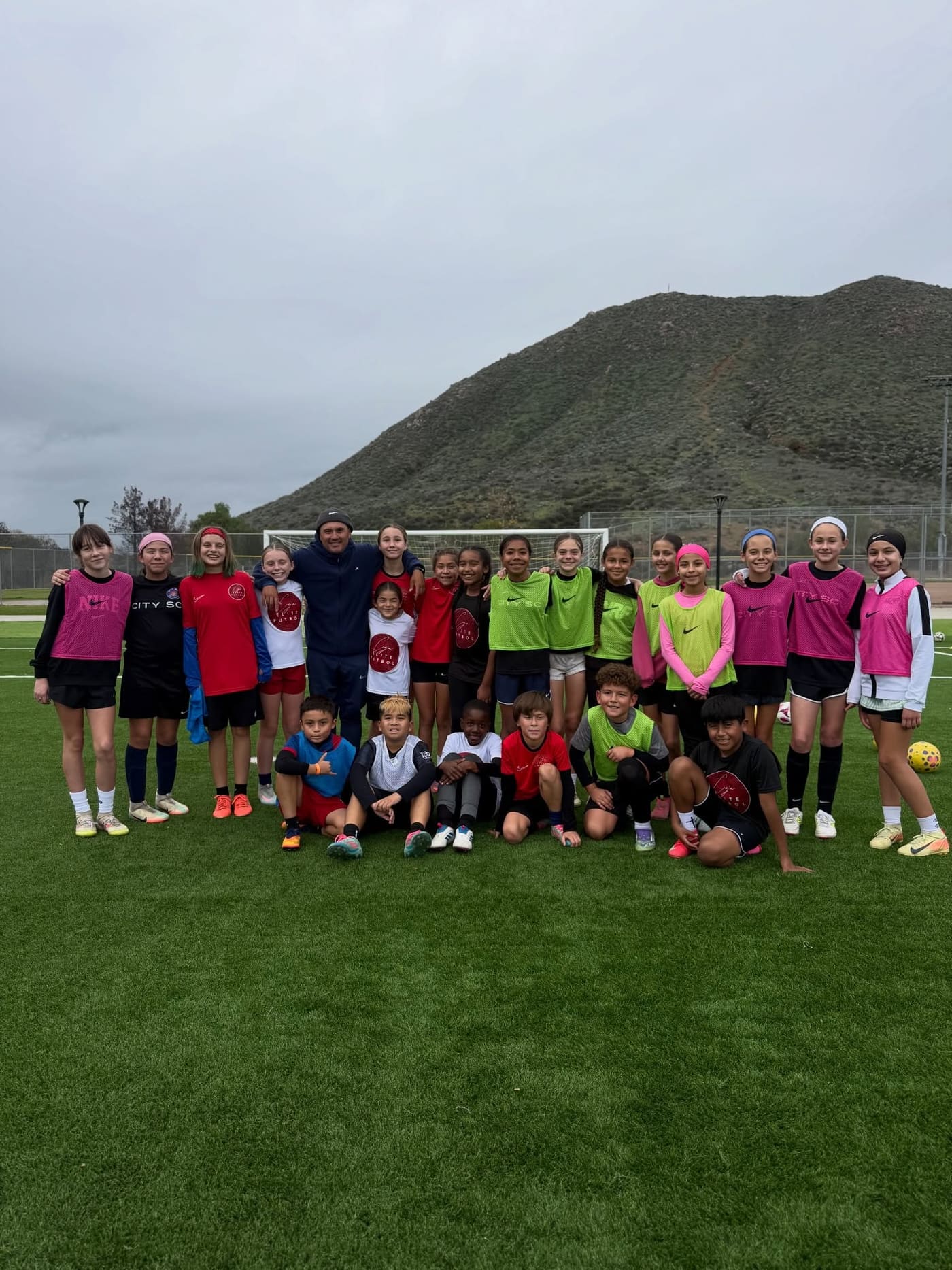 A full training group with Coach Ceja on a Lake Elsinore field